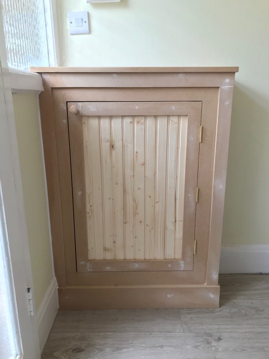 Beaded door meter cabinet in hallway