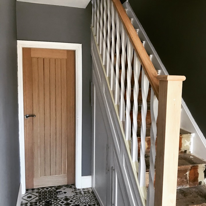 Oak Handrails and Newel posts with white twist spindles. Harrison