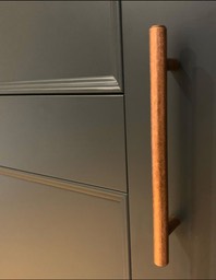 Modern shaker with beaded doors and copper handles