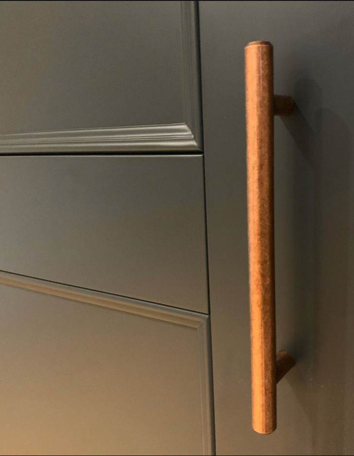 Modern shaker with beaded doors and copper handles